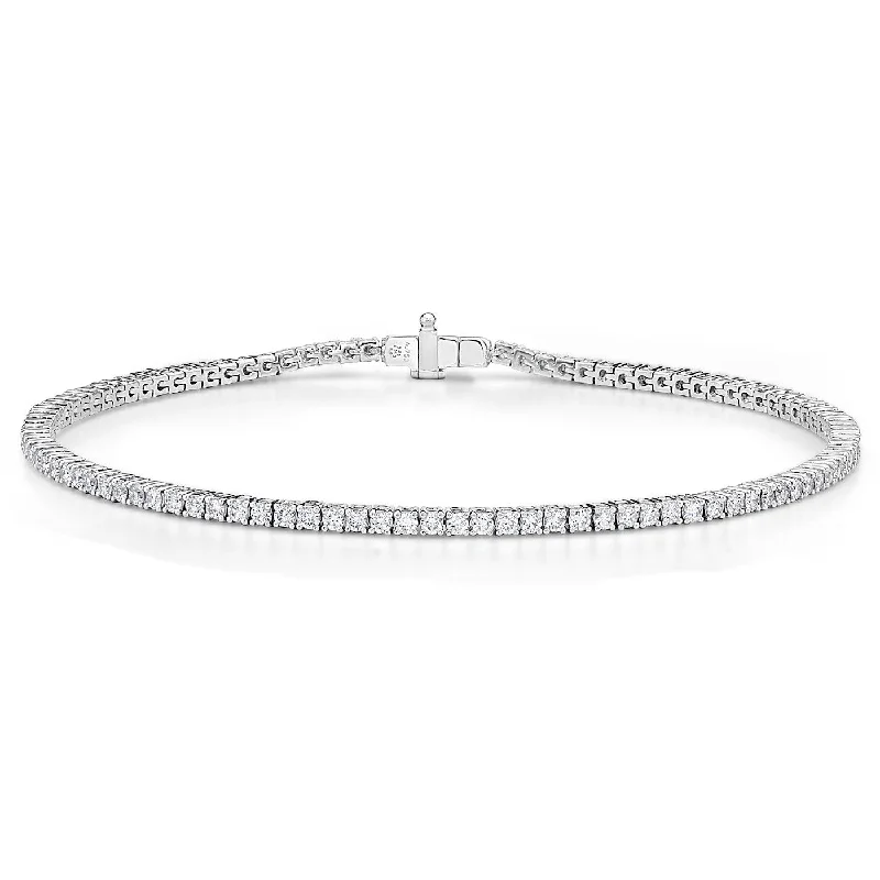 Ladies bracelets artisan metalwork designs-Memoire 18k White Gold 4-Prong Classic Tennis Bracelet